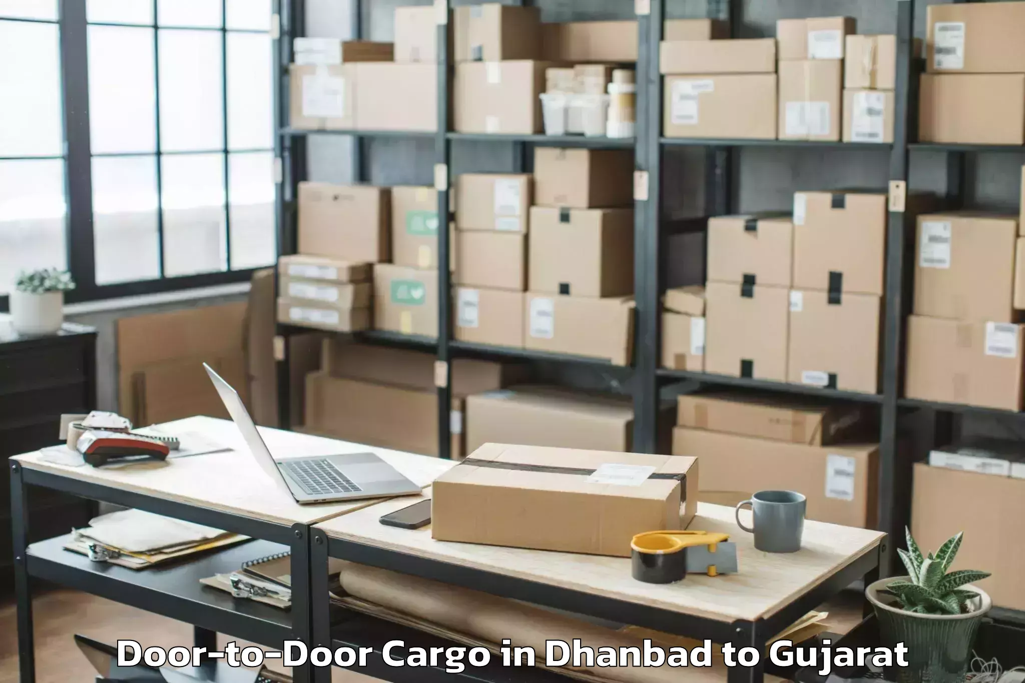 Easy Dhanbad to Una Gir Somnath Door To Door Cargo Booking